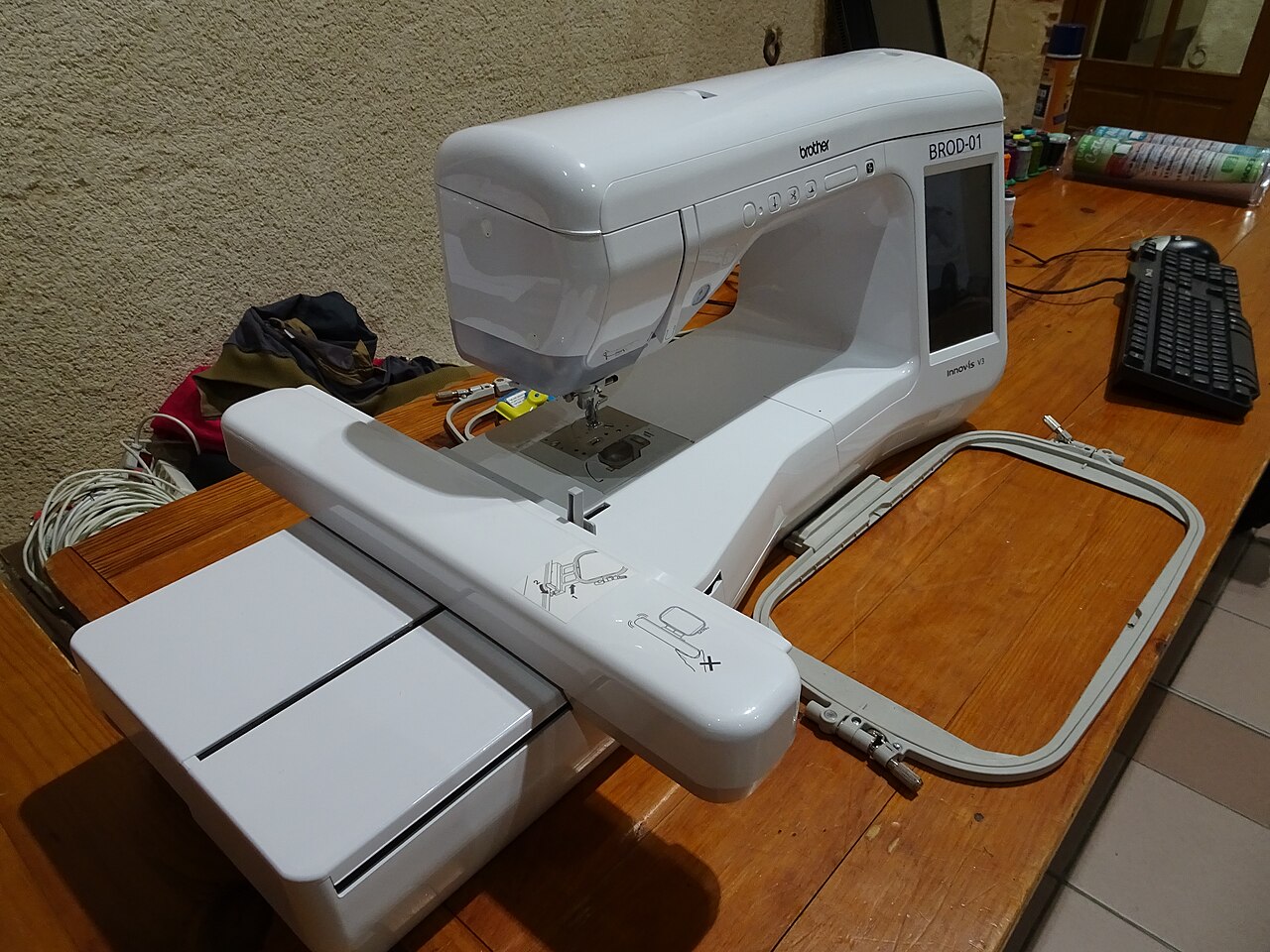 Brother home embroidery machine with large hoop on the embroidery arm