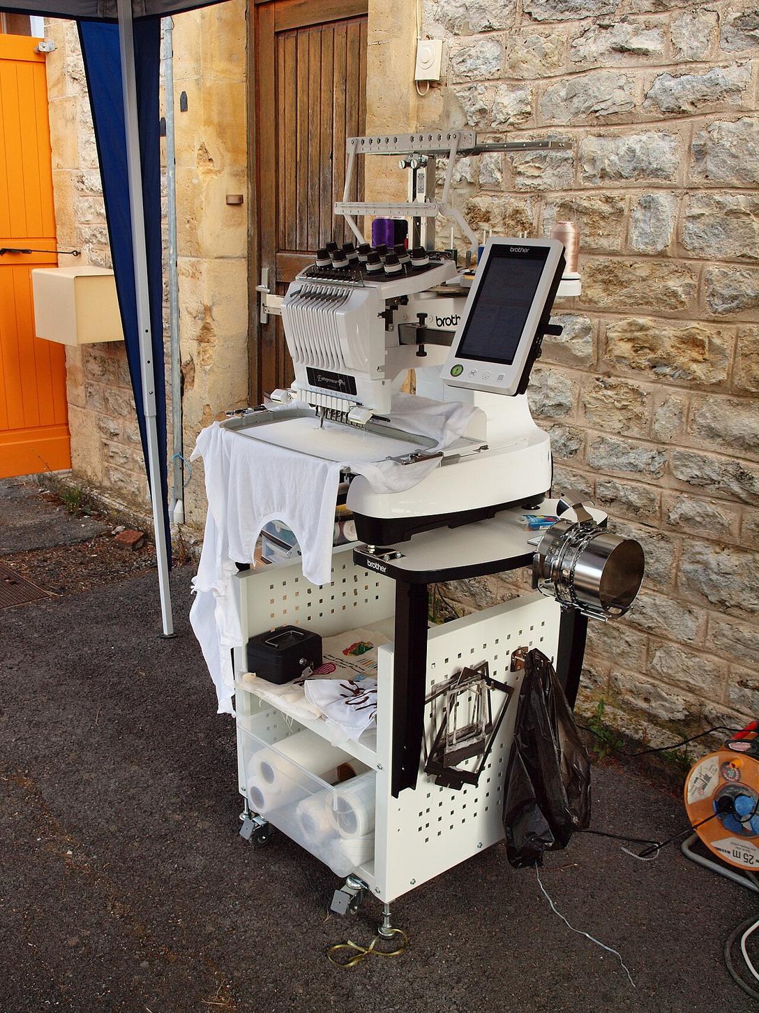 Brother multi-needle embroidery machine on a mobile stand