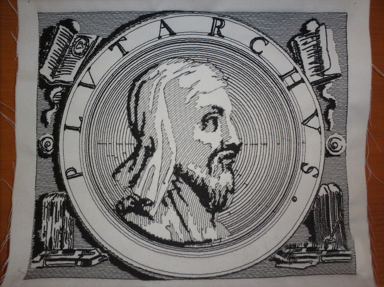 Machine-embroidered black and white portrait of Plutarch